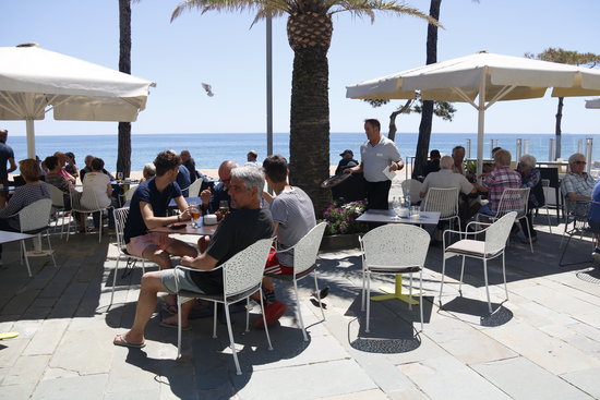 Tourists beside Catalonia's Mediterranean coast